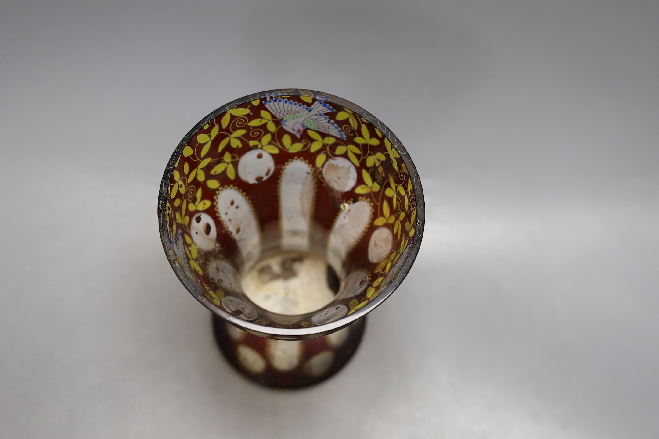 An American? enamelled glass vase and a ruby glass bowl, bowl 23.5 cms diameter.